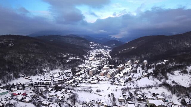 Aerial Shot Of Valley Settlement. Scenic Overhead View Of Mountain Village Nestled In Gorge
