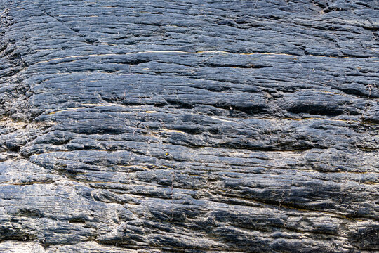 Horizontal sedimentary rock stratification with weathering patterns at Novoromanovskie Cliffs