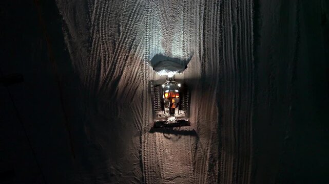Night Snow Grooming. Aerial View Shows Snowcat Meticulously Preparing Ski Slopes For Dawn With Lights