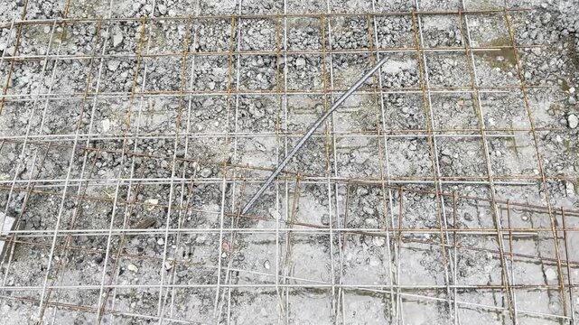 puddles of water with rebar in a rain storm