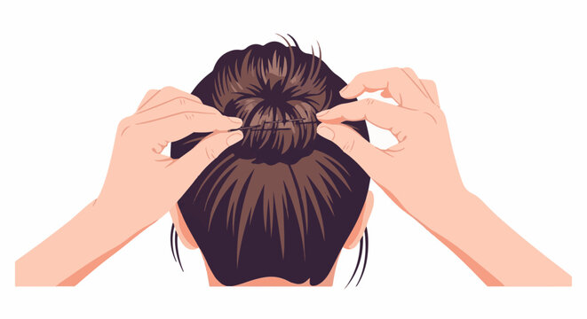 Two hands securing a brown hair bun with pins against a white background