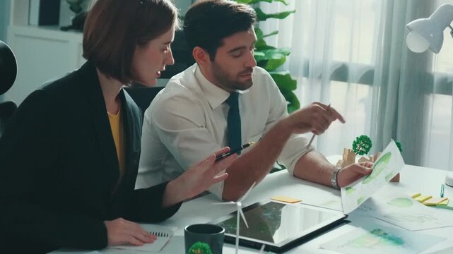 Top aerial view of businessman and manager talking about clean energy investment. Aerial view of business team working together planning to use renewable energy. ESG modern development. Alimentation.
