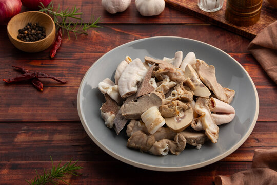 Pork Giblets or Pig Offal in a plate.Boiled Mixed Pork Offal ,Intestines ,Guts ,Chitterlings ,Heart ,Kidney ,Liver ,Spleen and Lung.