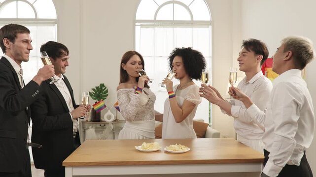 Friends celebrating Pride wedding with champagne toast
