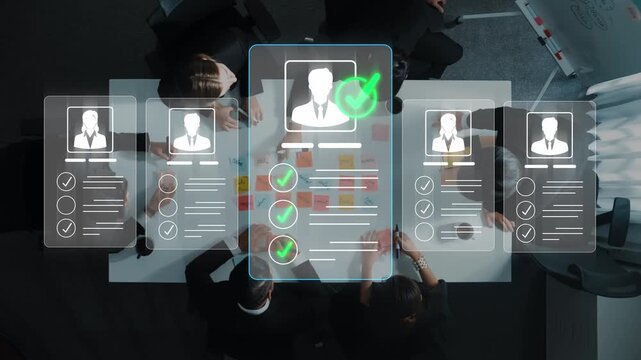 Overhead View of Business Team Collaborating on Recruitment Process with Digital Profiles and Checklists in Modern Office Setting Sigmoid