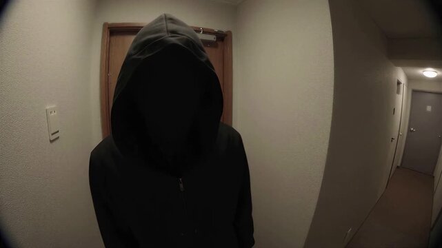 Suspicious Figure Seen Through Apartment Peephole, Approaching the Peehole, 4K, Copy space on the right
