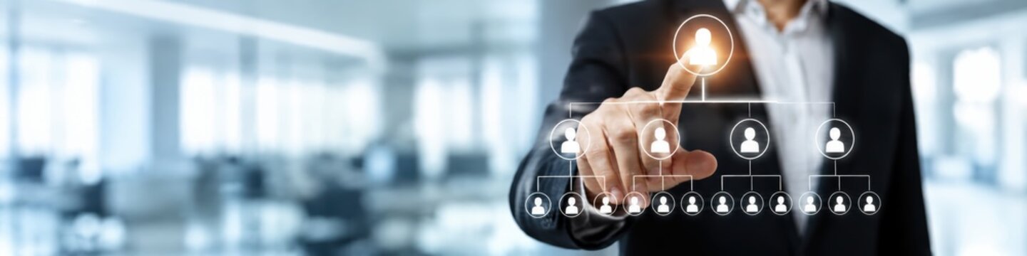 Business leader touching a virtual organization chart on a digital interface, representing human resources, team management, corporate hierarchy, networking and recruitment
