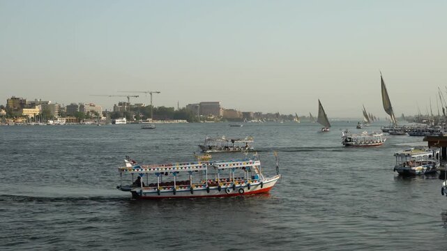 Felucca Sailboats and Tour Boats on the Nile River in Aswan, Egypt