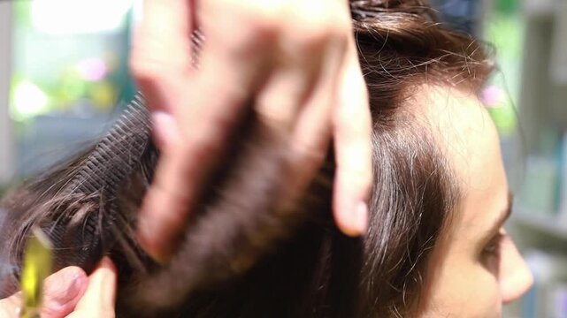 Trimming split ends with hair scissors