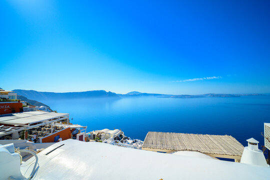 Wide caldera view over white Oia rooftops