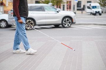 Blind african american man walking with white cane