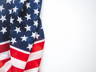 Fototapeta premium American flag on a white background. Patriotic concept with space for text. Perfect for Independence Day, Flag Day, and other American holidays. Design for marketing campaigns and social media content