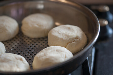 Fototapeta premium Making homemade syrniki at home in the kitchen