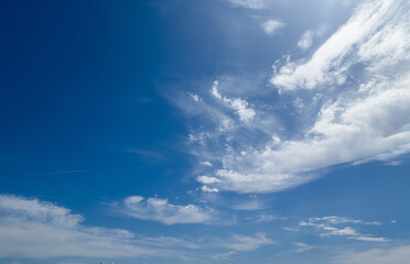 Obraz premium Bright blue sky, hot, soft clouds, fresh wind, nature of spring, 