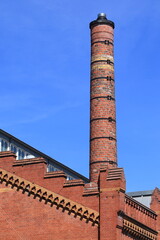 Fototapeta premium Hobbemakade Red Brick Building Exterior Detail with Chimney in Amsterdam, Netherlands