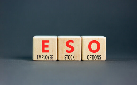 ESO employee stock options symbol. Concept words ESO employee stock options on beautiful wooden blocks. Beautiful grey background. Business ESO employee stock options concept. Copy space.