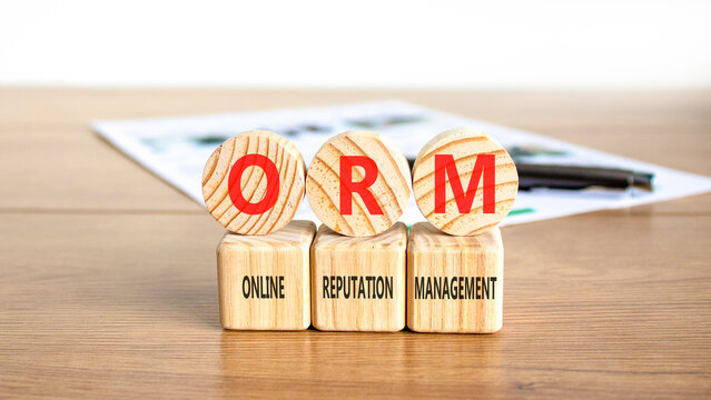 ORM online reputation management symbol. Concept words ORM online reputation management on beautiful wooden circles. Beautiful wooden background. Business ORM concept. Copy space.