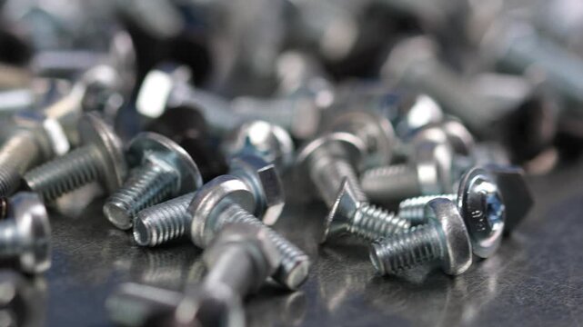 Metal screws for fastening equipment. Soft focus. Close-up. 