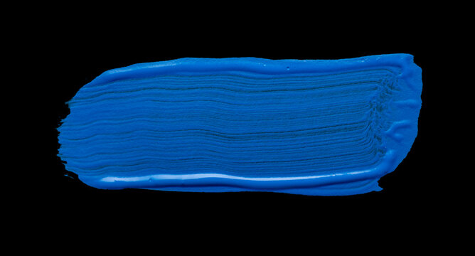 Blue abstract oil paint spot. Blue oil paint brush stroke on black background.