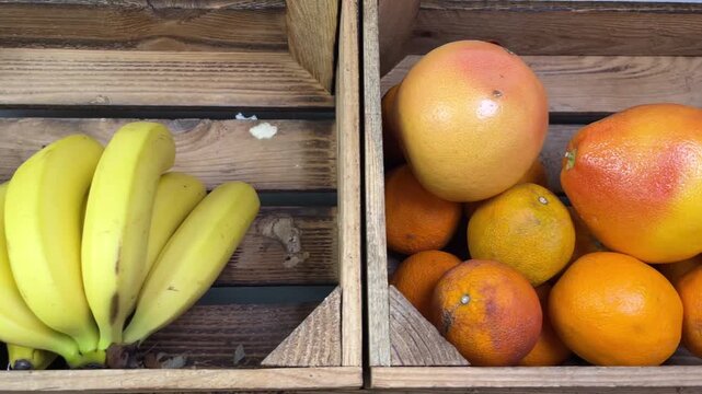 Produce Market Display &ndash; Fresh Bananas and Grapefruits in Wooden Crates