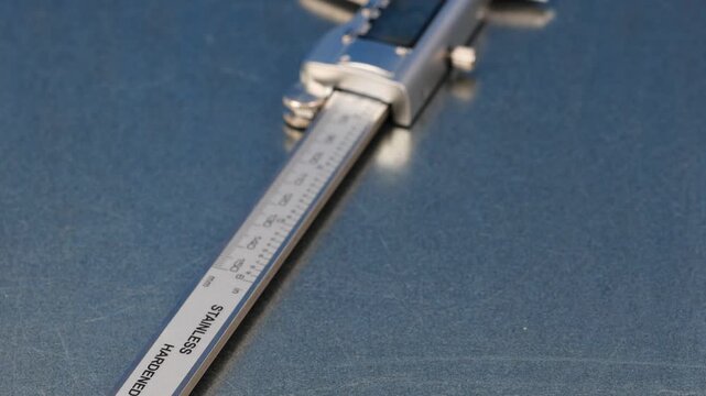 A caliper with an electronic display for measuring parameters.