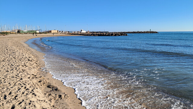 Mediterranean sandy beach next to Puerto Siles marina in Canet de Berenguer