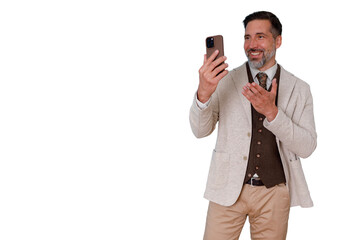 Naklejka premium Mature man in business casual wear using smartphone for a video conference, discussing and smiling, engaging virtually