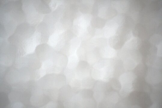 Abstract white styrofoam texture macro shot. Closed-cell expanded polystyrene background.