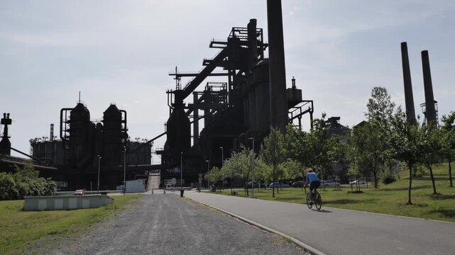 The footage connects modern urban life with historic industrial architecture and the unique atmosphere of this technical complex.