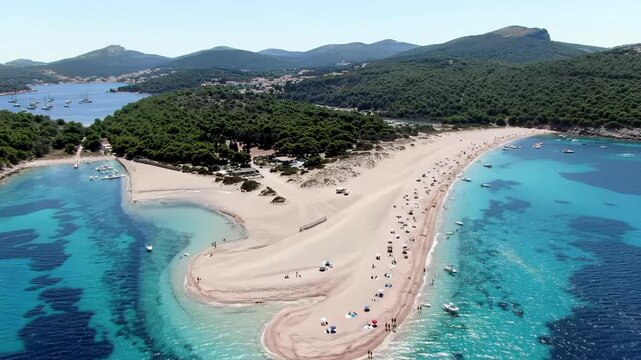 High-angle drone video of iconic Zlatni Rat beach, Croatia. White sand spit, clear turquoise Adriatic Sea, lush pine forest, sunbathing individuals. Idyllic vacation concept