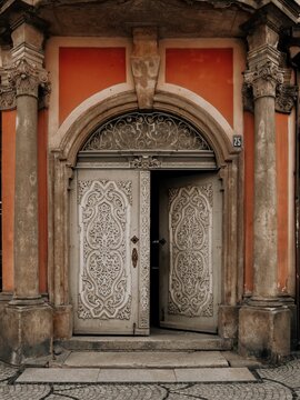 Ornate Vintage Wooden Door with Fluted Pilasters and Transom Window, Historic Building Entrance