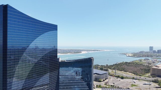 Drone pan right view of Atlantic City skyline starting from the inlet area
