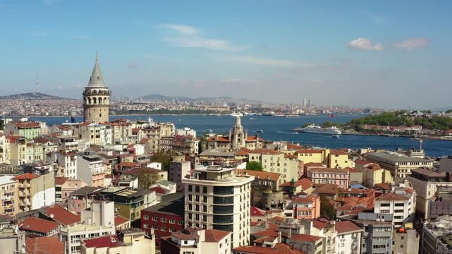 Aerial drone panning view of Golden Horn bay in Istanbul with Galata tower, Galata bridge, Fatih, Sultanahmet district with Hagia Sophia, Blue Mosque, Suleymaniye mosque and Halic bridge