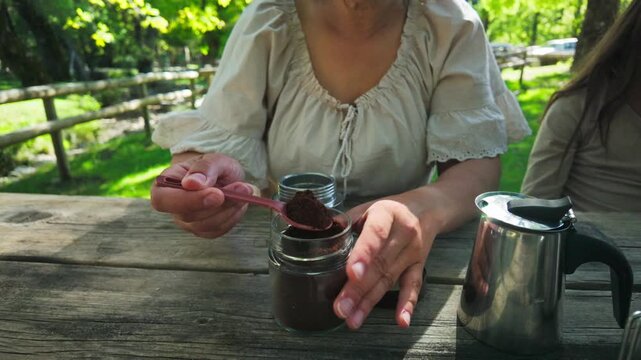 Preparing Fresh Coffee for a Happy Family Picnic in Nature