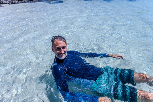 Man floating in glapagos water
