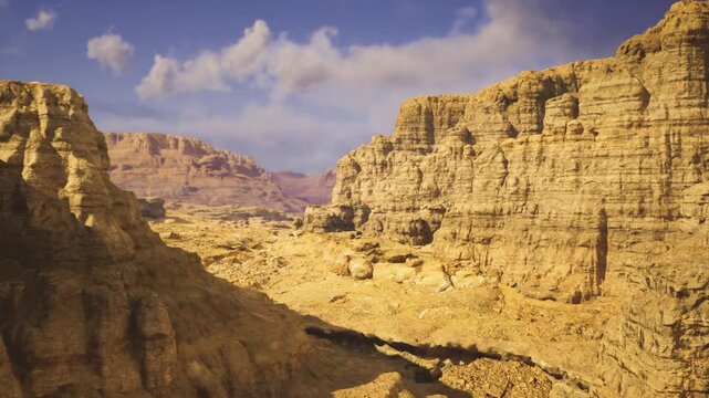 Winding hiking route through sandstone canyons with steep cliffs and narrow passes, rocky trail cutting across sunlit slopes, palpable sense of challenge
