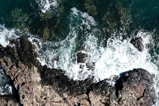 waves crashing on rocks