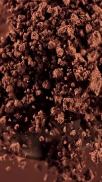 Cocoa powder falls from a spoon. Filmed on a high-speed camera at 1000 fps. High quality FullHD footage