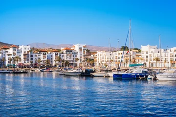 Agadir Marina in Morocco. Popular tourist area with luxury apartments, boats in harbor, shops and restaurants. Moroccan seaside resort on shore of Atlantic ocean in Africa © Julia Lavrinenko