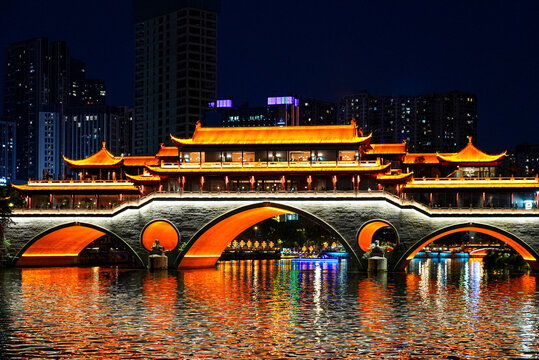 Anshun Bridge with traditional architecture over the Jin River at night, Chengdu, Sichuan, China