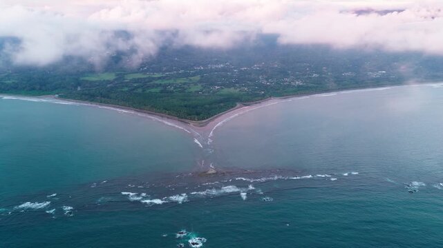 Stunning aerial perspective showing the iconic whale tail shaped sandbar at Marino Ballena National Park in Uvita, Costa Rica at low tide