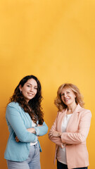 Fototapeta premium Professional women with crossed arms standing confidently, representing mentorship, corporate success, and diverse experience