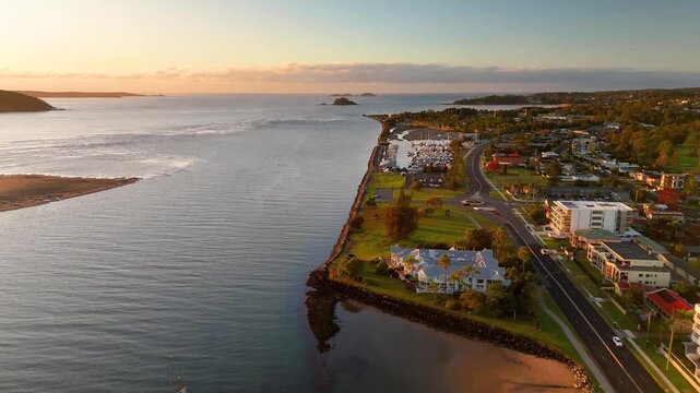 Panoramic aerial drone view of Batemans Bay on the NSW South Coast, Australia, looking out to the coastline and Tasman Sea on a sunny early morning in May 2026   