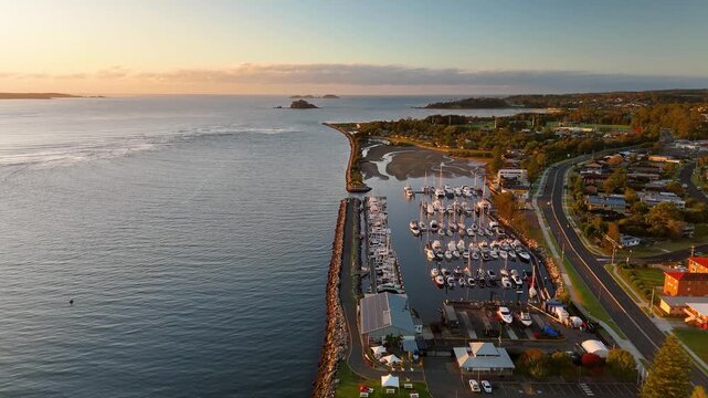 Panoramic aerial drone view of Batemans Bay on the NSW South Coast, Australia, looking out to the coastline and Tasman Sea on a sunny early morning in May 2026   