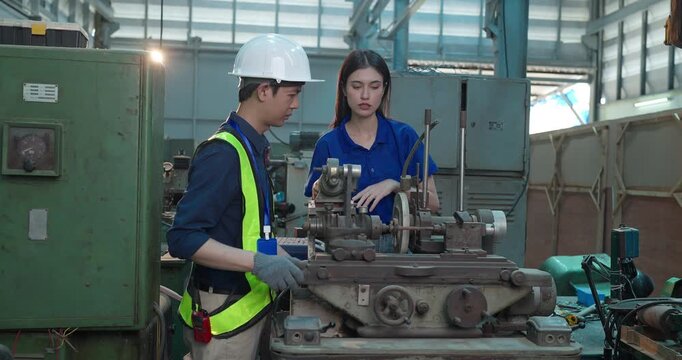 Engineer Demonstrates Product Testing Machine to Startup Entrepreneur in Small Lab Workshop