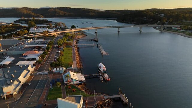 Aerial drone view of Batemans Bay on the NSW South Coast, Australia, looking to Clyde River Bridge and the CBD on a sunny early morning in May 2026   