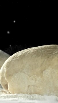 The dough falls on the table. Filmed on a high-speed camera at 1000 fps. High quality FullHD footage