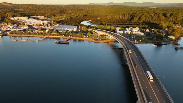 Aerial drone view of Batemans Bay on the NSW South Coast, Australia, looking to Clyde River Bridge and the CBD on a sunny early morning in May 2026   