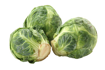 Obraz premium Three fresh green Brussels sprouts with visible leaves and stems on black background vegetable