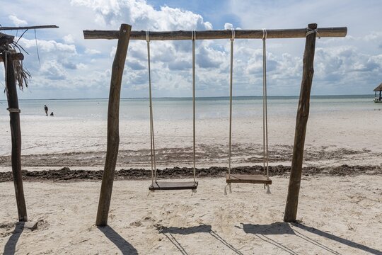 Swing on a white sand beach, Holbox island, Yucatan Mexico